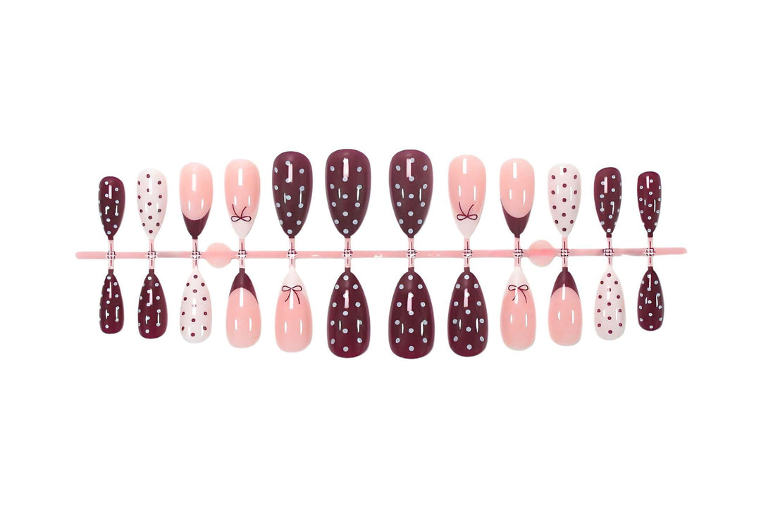 Artificial nail set with elegant bow and dot motifs Kalsten