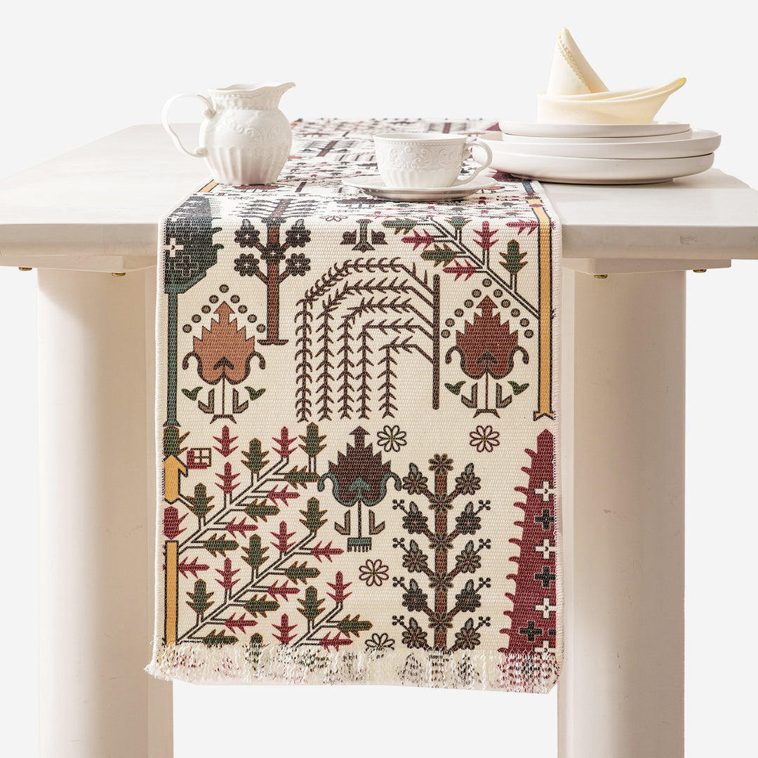 Jacquard table runner with floral vine structure and decorative fringes Kalsten