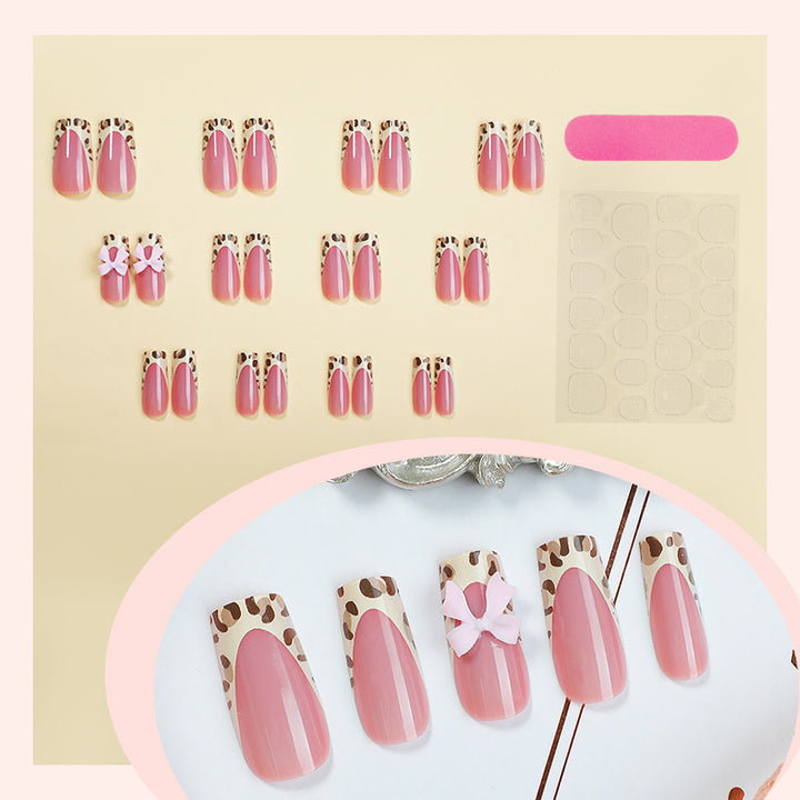 Nail set with elegant leopard accents and bow embellishments Kalsten