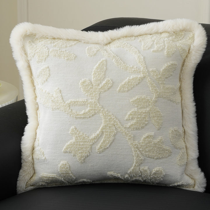Square decorative pillow with embossed circular relief and soft faux fur edging