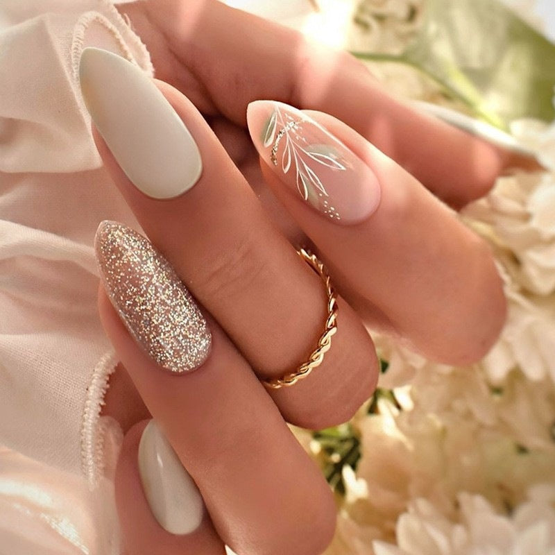 Artificial nail creation with glamorous tips and glitter details Kalsten