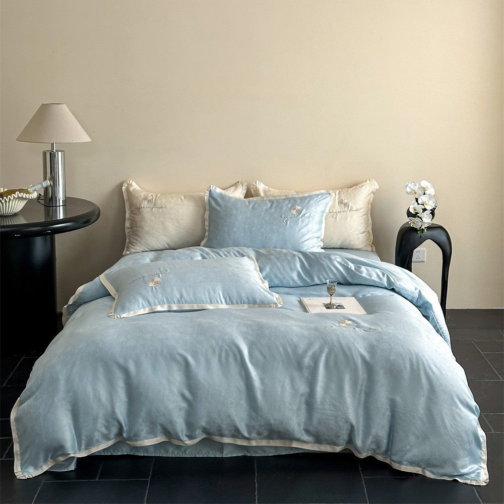 Luxurious cotton satin bedding set with jacquard relief and embroidered rose motif