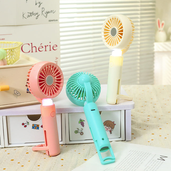 Women portable mini hand fan with integrated LED lighting and USB charging function Kalsten