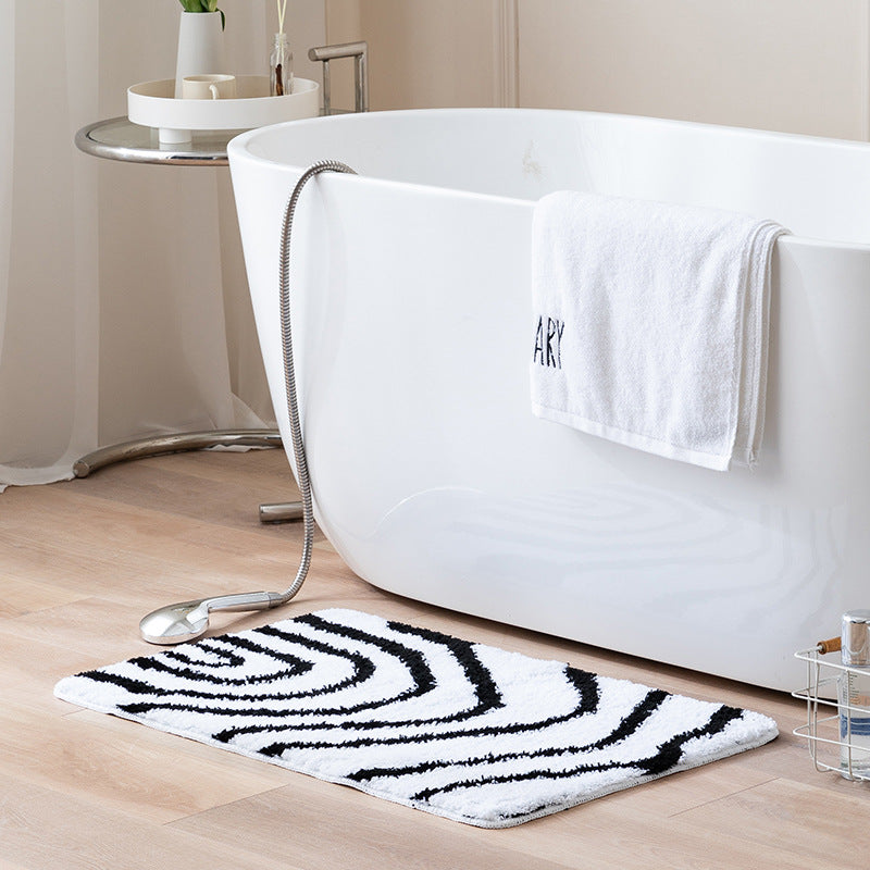 Fluffy bath mat with abstract wave pattern and non-slip back