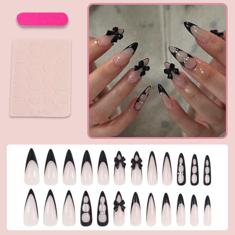 Acrylic nail set with shimmering accents and elegant bows Kalsten
