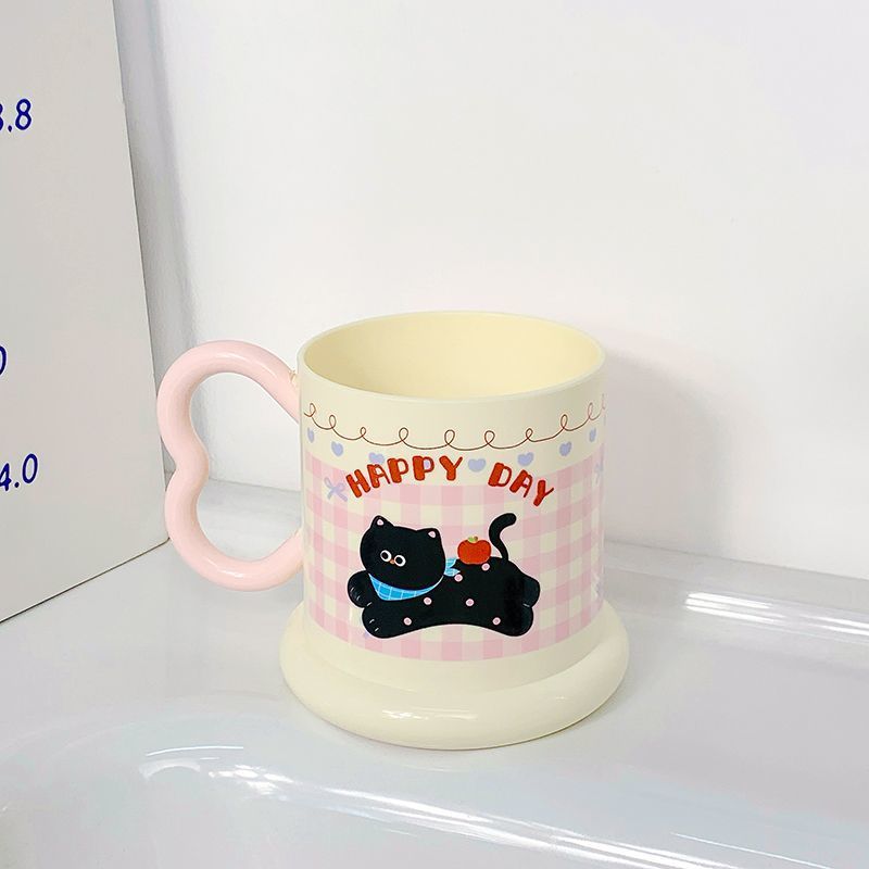 Ceramic mug with playful puppy motif Kalsten