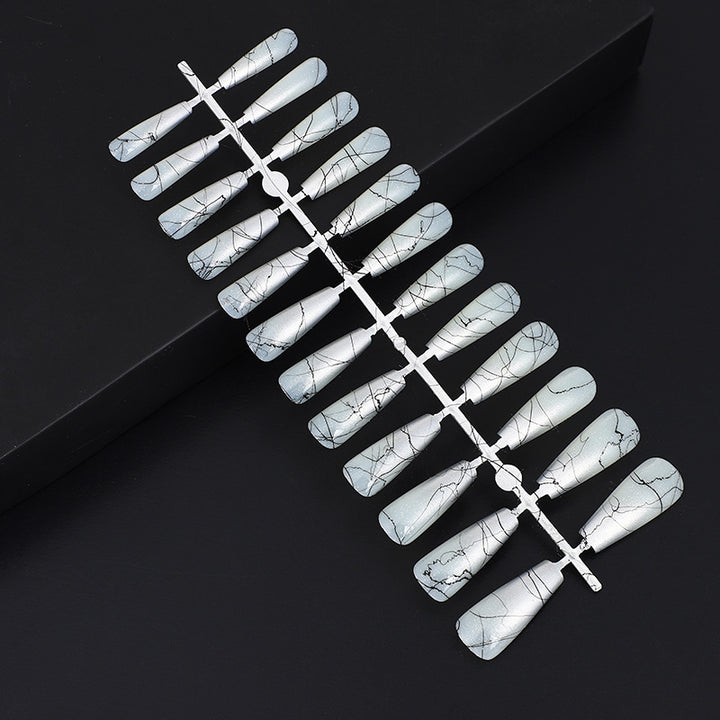 Artificial nails in modern ombre design with marbled accents Kalsten