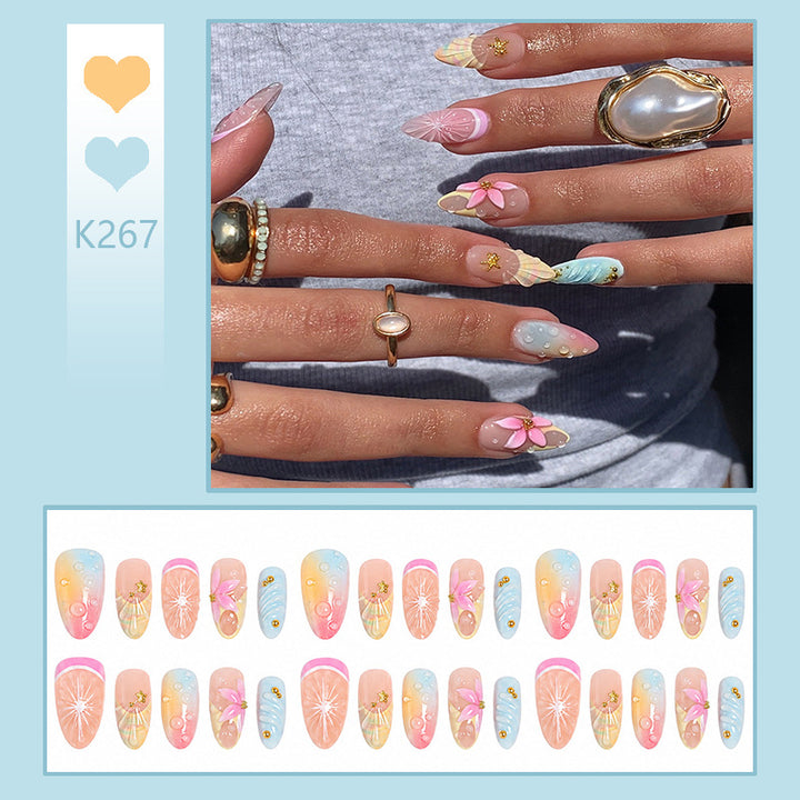 Artificial nails with creative flower and glitter detail Kalsten