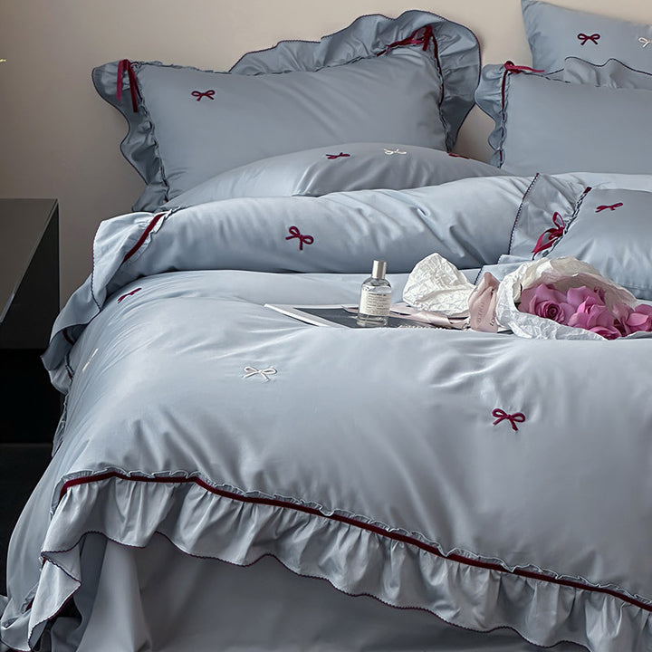 Premium bedding set made of cotton satin with ruffles and bow embroidery