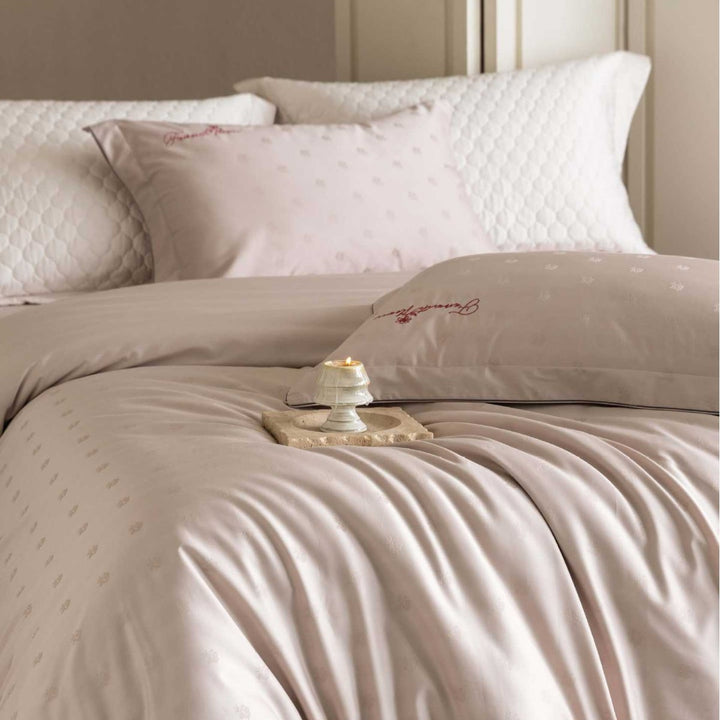 Luxurious satin bedding complete set with quilted cover and delicate logo embroidery