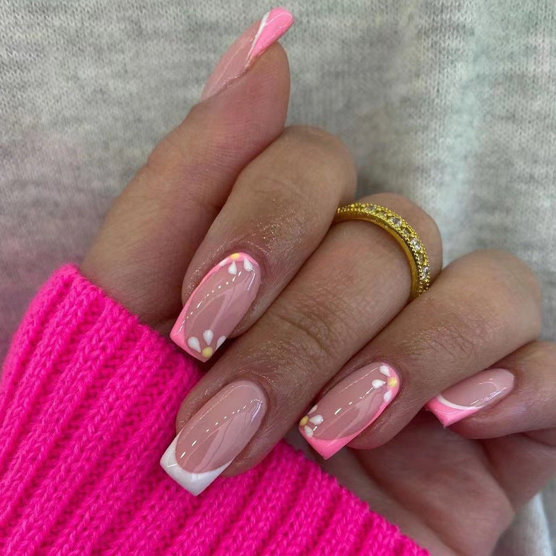 Artistic nail art with floral design and glitter accents Kalsten