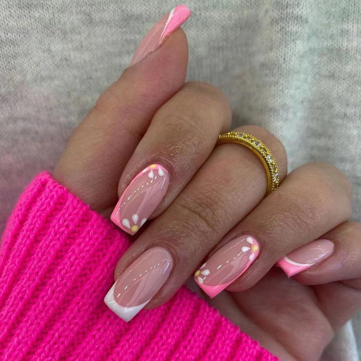 Artistic nail art with floral design and glitter accents Kalsten
