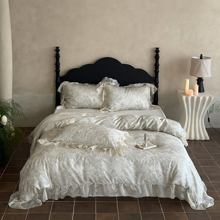 Elegant bedding set made of fine satin jacquard with delicate floral relief and decorative ruffle