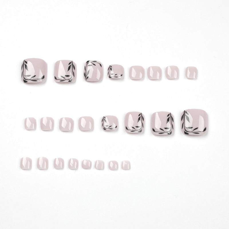 Artful toenail art with delicate leaf motifs Kalsten