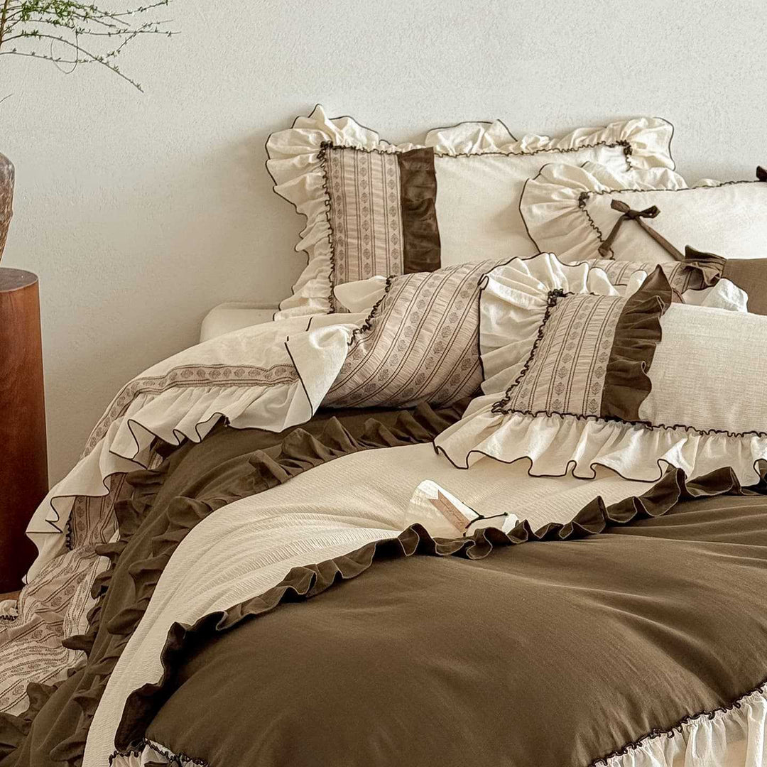 Country house style cotton-linen bedding set with ruffles, striped bedspread and decorative pillow