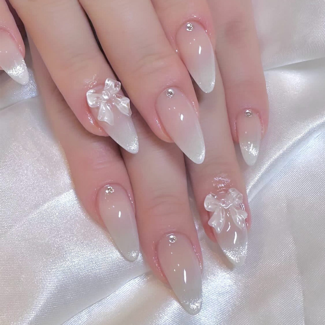Elegant Stiletto Nails with Glitter and Bow Accents Kalsten