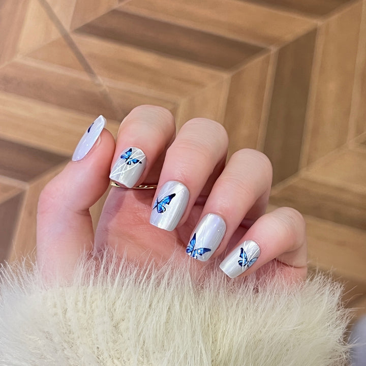 Creative nail extensions with intricate butterfly design Kalsten