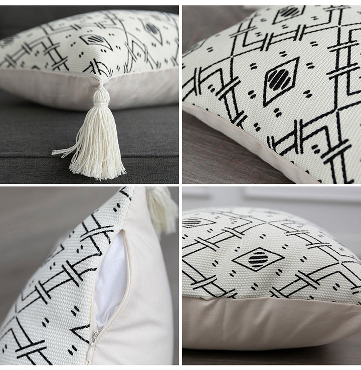 Square decorative cushion cover made of cotton blend with handwoven texture, geometric diamond print, and corner tassels