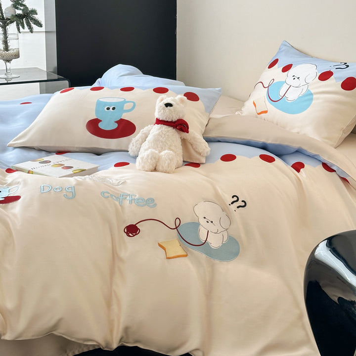 Reversible cotton bedding set with cute dog motif and polka dot border