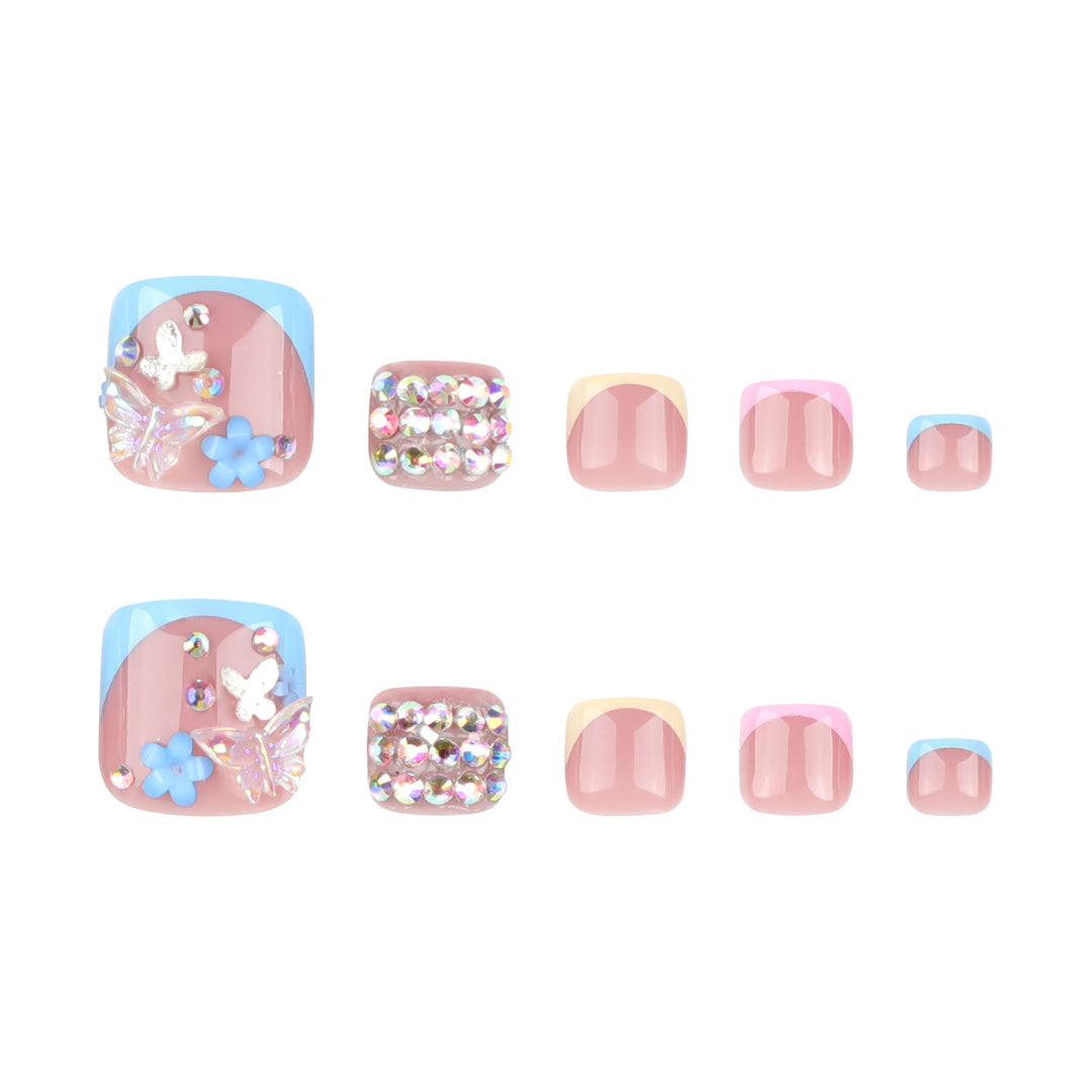 Artful toenail art with glitter and flower motifs Kalsten