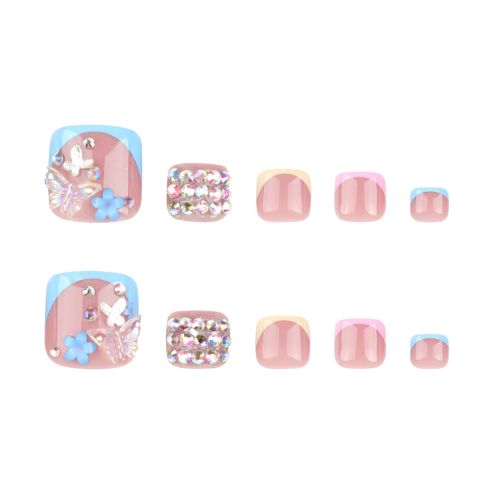 Artful toenail art with glitter and flower motifs Kalsten