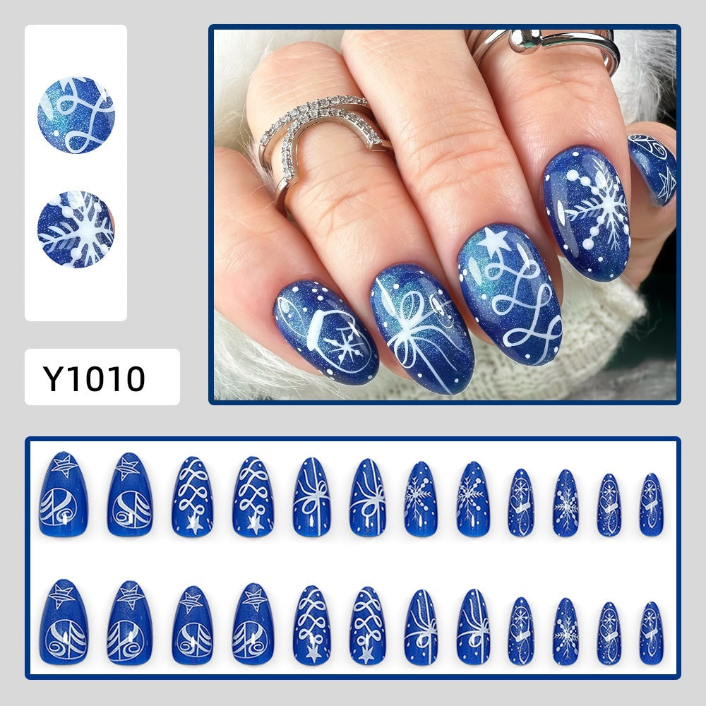Artificial nails in festive winter design with glittering snowflakes and elegant decorations Kalsten