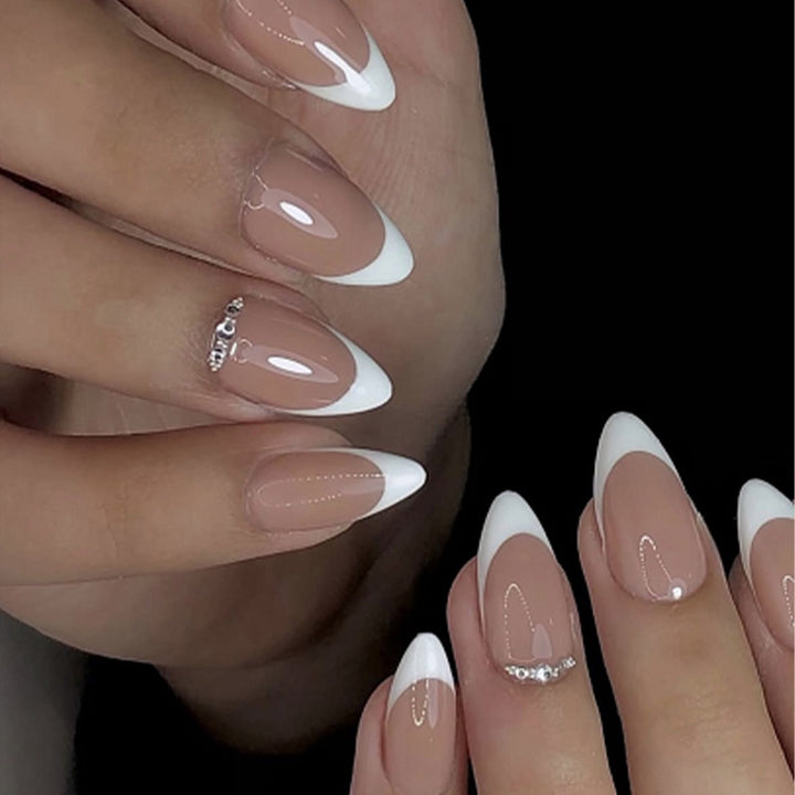 Artificial nail set with elegant French tip look and shimmering accents Kalsten