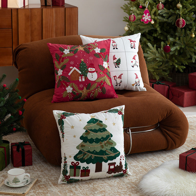 Festive embroidered decorative pillow with reindeer motif and removable cover