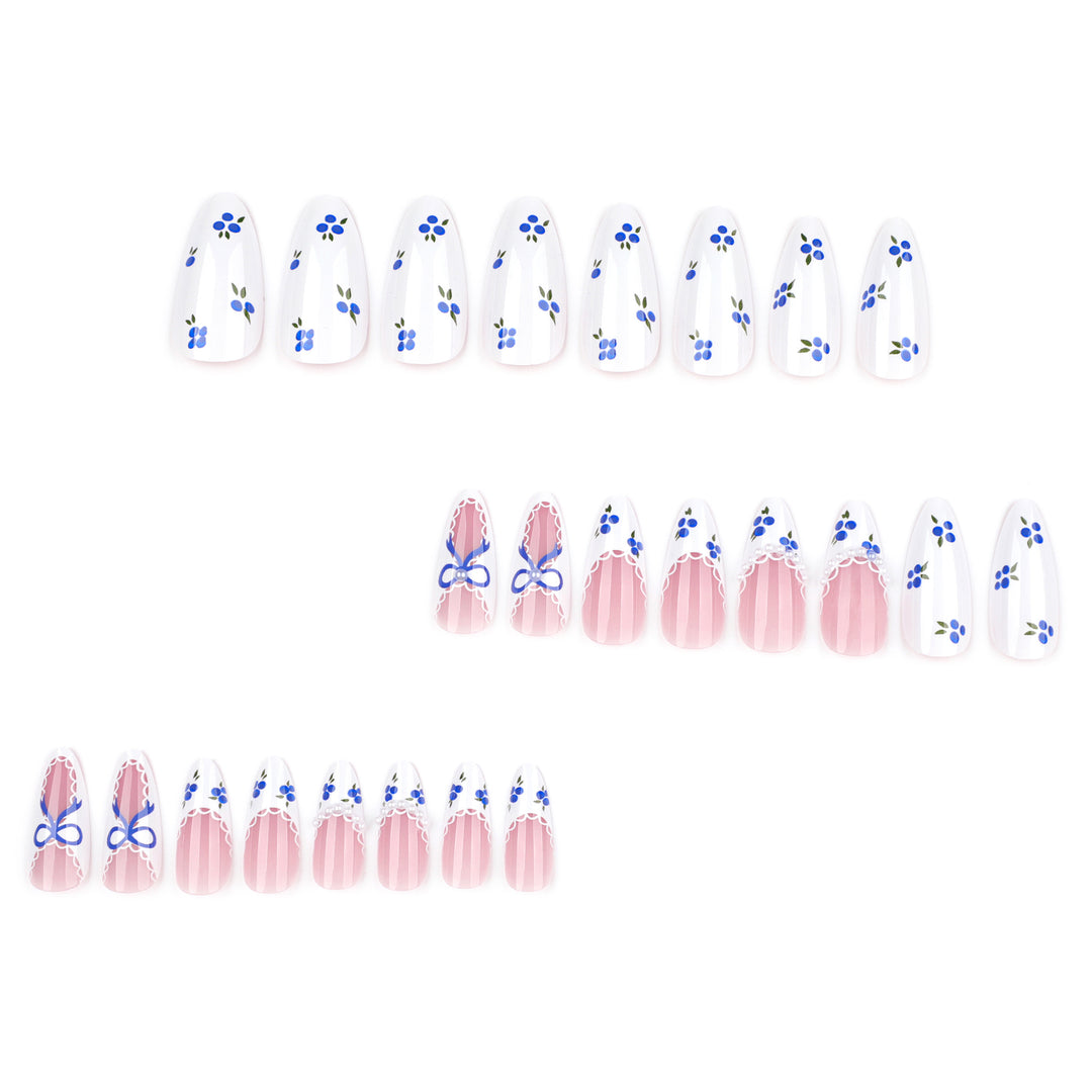 Artful nail art with floral accents and bow embellishment Kalsten