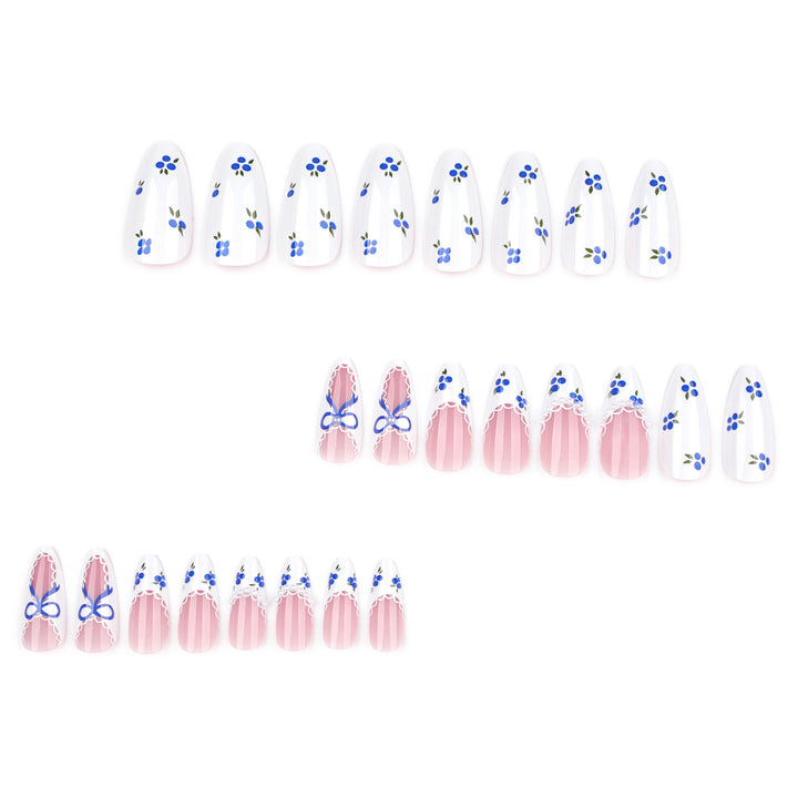 Artful nail art with floral accents and bow embellishment Kalsten