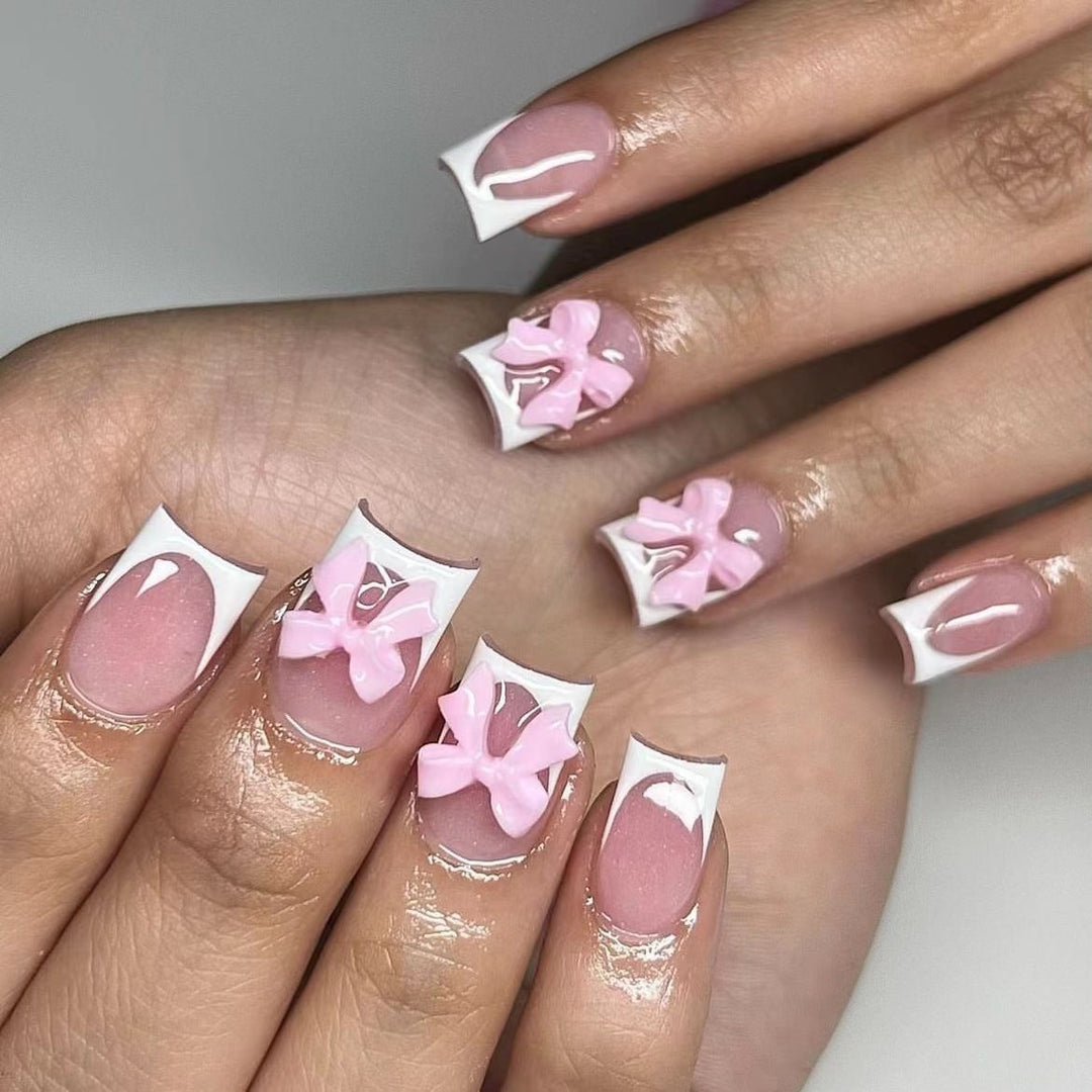 Acrylic nail set with playful bow design Kalsten