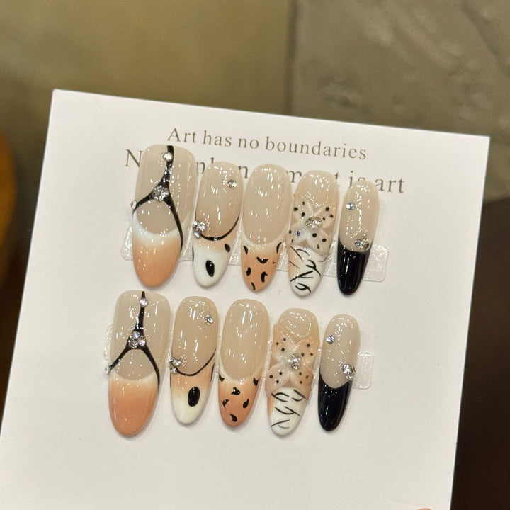 Artistic Press-On Nail Art Set with Unique Patterns and Gem Accents