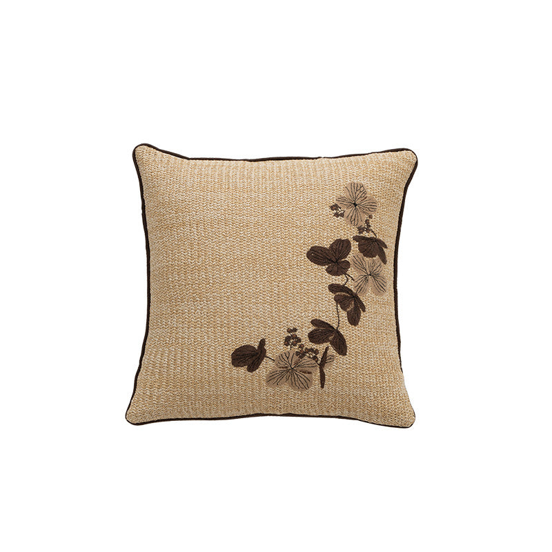 Square decorative cushion with woven texture and floral embroidery