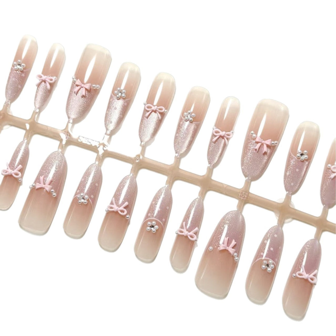 Artificial nails with elegant glitter and bow design Kalsten