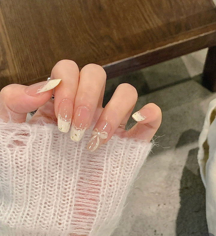Decorative Press-On Nail Extensions with Bow and Rhinestone Accents Kalsten