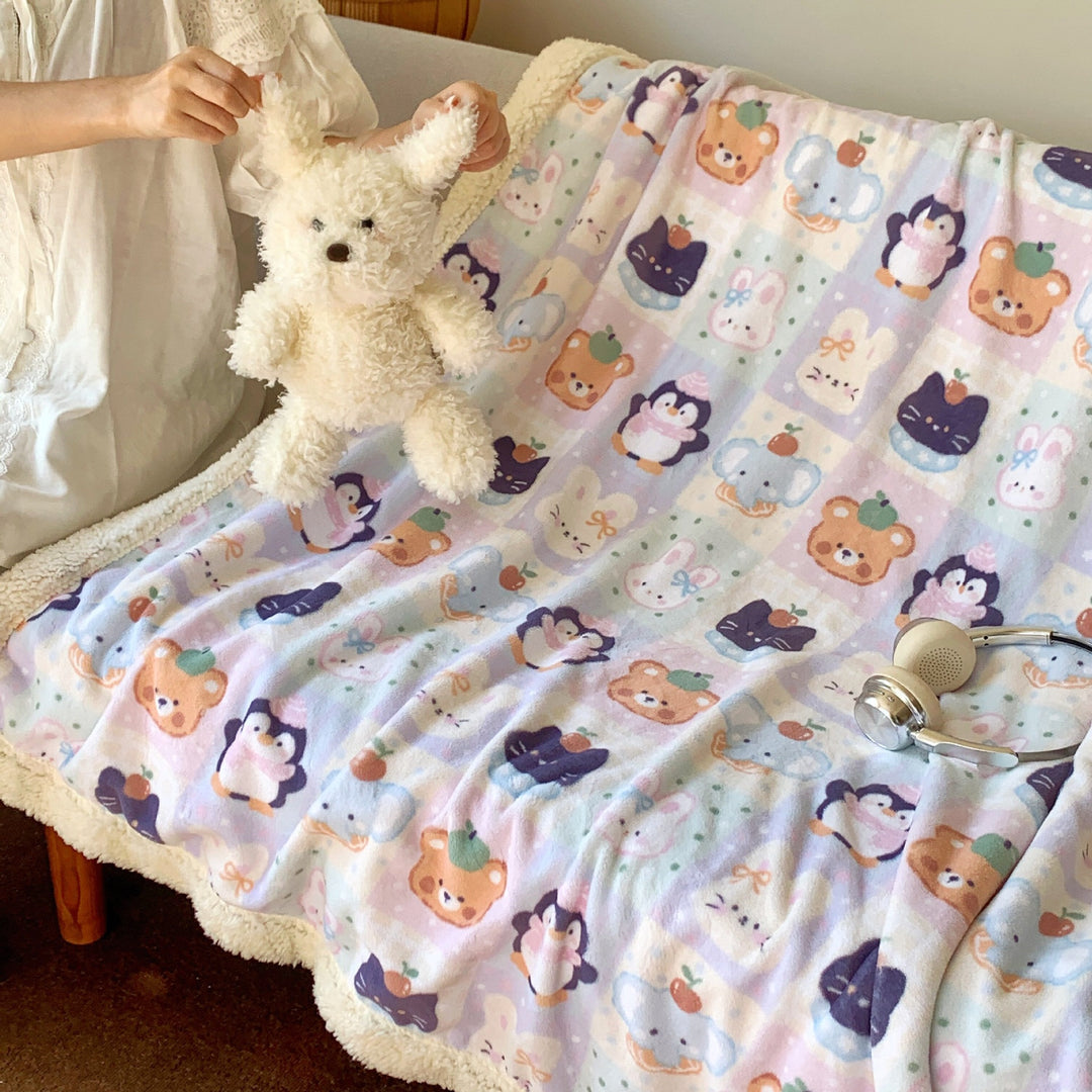 Reversible fleece blanket with cartoon cat design and teddy lining