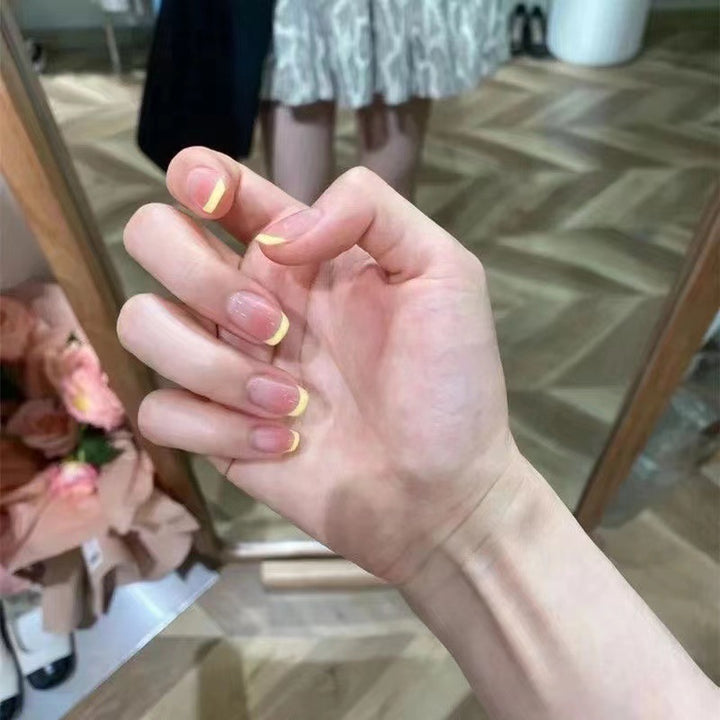 Elegant French Tip Press-On Nails with Unique Finish