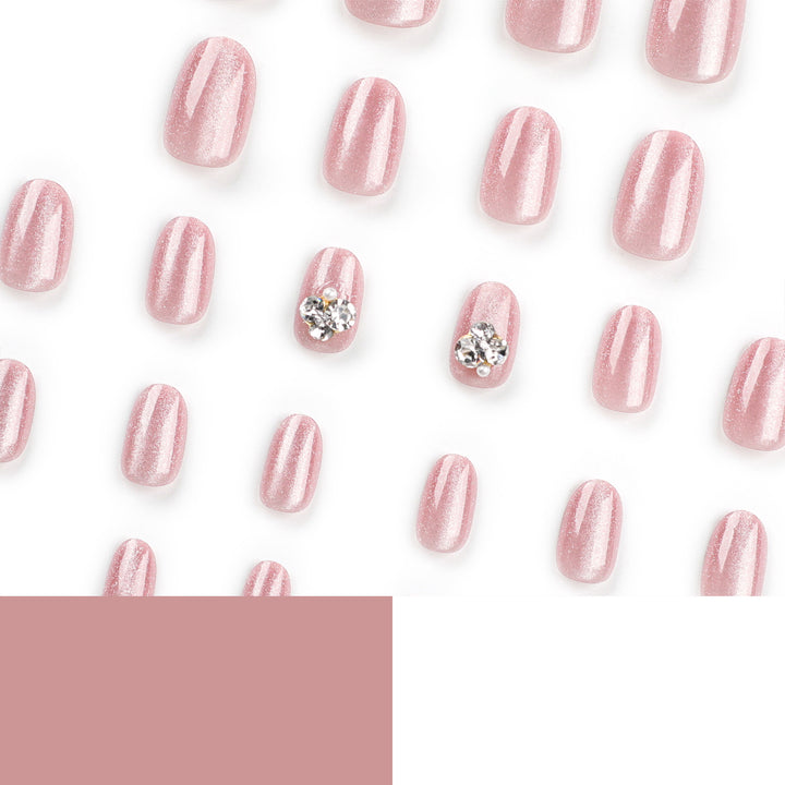 Artful glitter nail extensions with elegant rhinestone accents Kalsten
