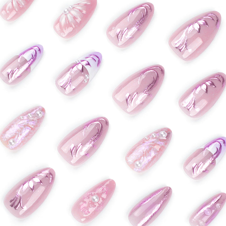 Artificial nail extensions with delicate floral designs and glitter accents Kalsten