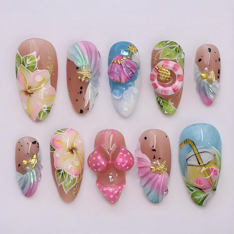 Artificial nail set with botanical designs and glamorous accents Kalsten