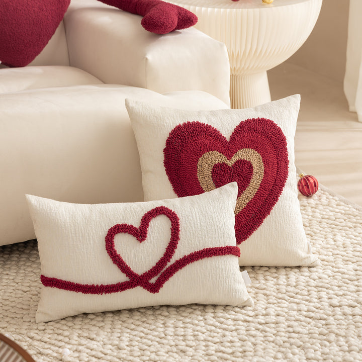 Heart-shaped cuddle cushion with extended arm applications Kalsten
