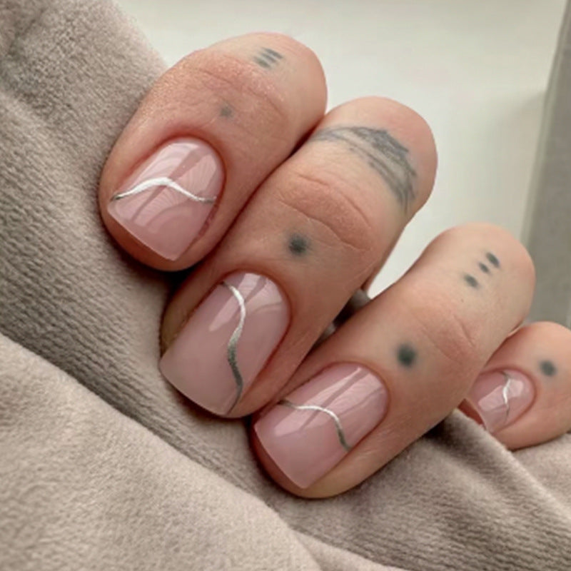 Acrylic nail set with elegant wave lines and shimmering accents Kalsten