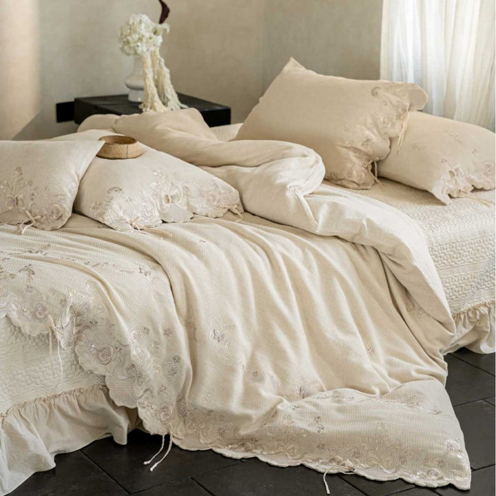 Luxurious embroidered linen bedding set with lace edge