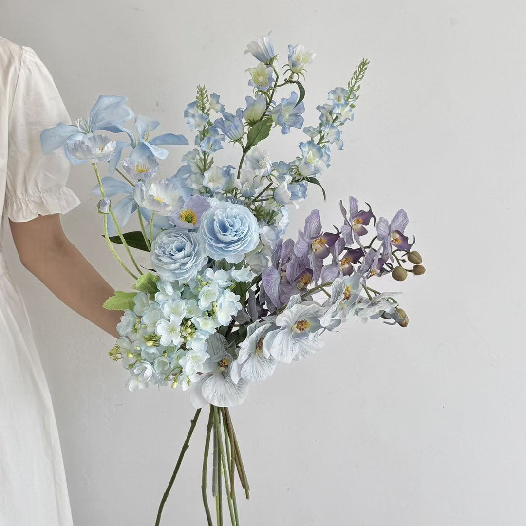 Luxurious artificial flower bouquet with blooming orchids