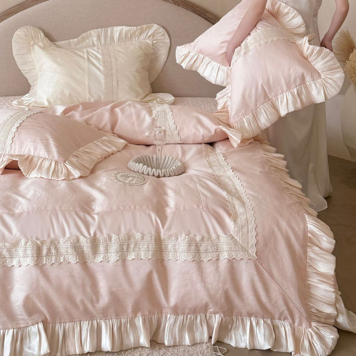 Duvet cover set with ruffle trim, fine lace border, and subtle jacquard structure