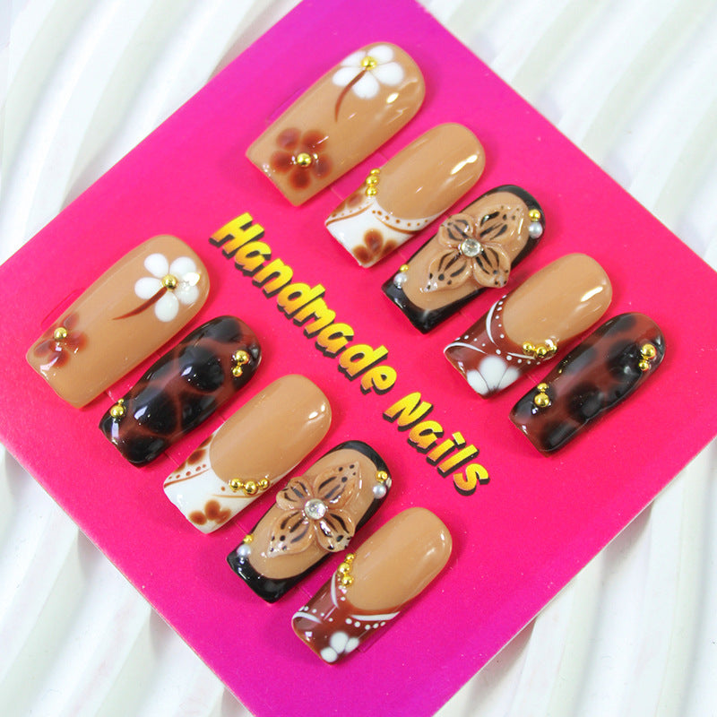 Acrylic nail set with elegant handcrafted designs and decorative accents Kalsten