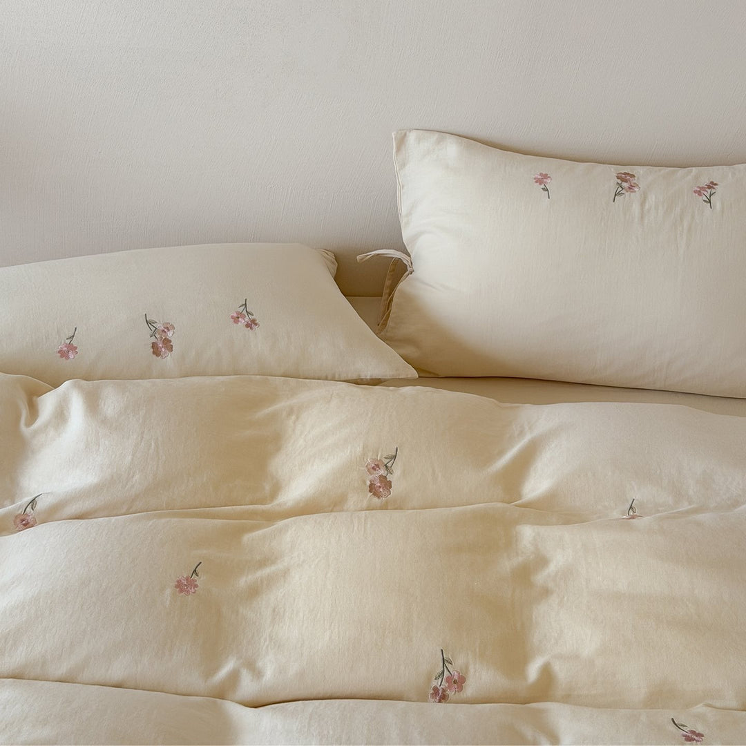 Embroidered cotton bedding set with delicate floral embroidery and tie bands
