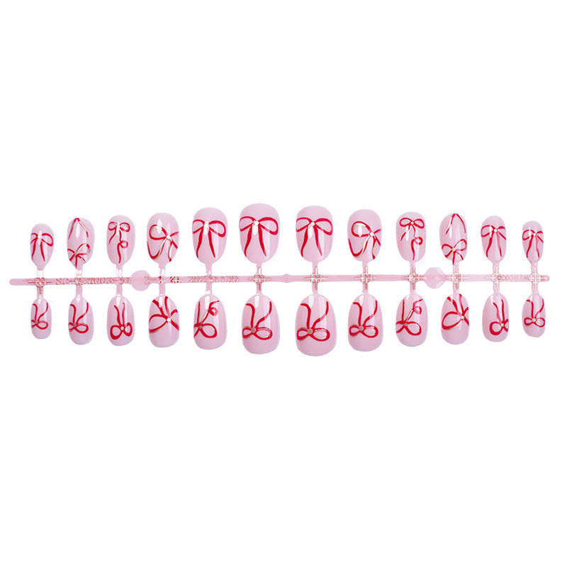 Artificial nail design with bow motifs Kalsten