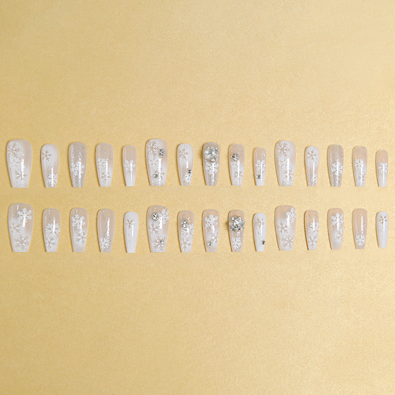 Artificial nail set with frosty snowflake design and sparkling 3D applications Kalsten