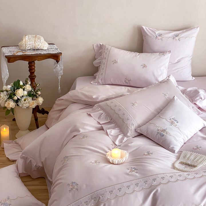 Luxurious cotton satin bedding set with floral embroidery, ruffle and decorative pillow